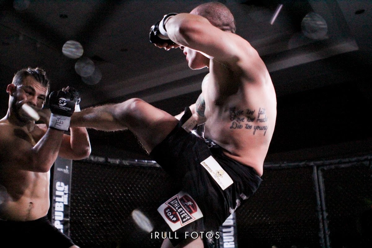 High kick in the cage